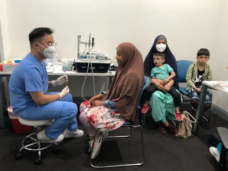 Doctor provides care to a young child, promoting family preservation and child safety.